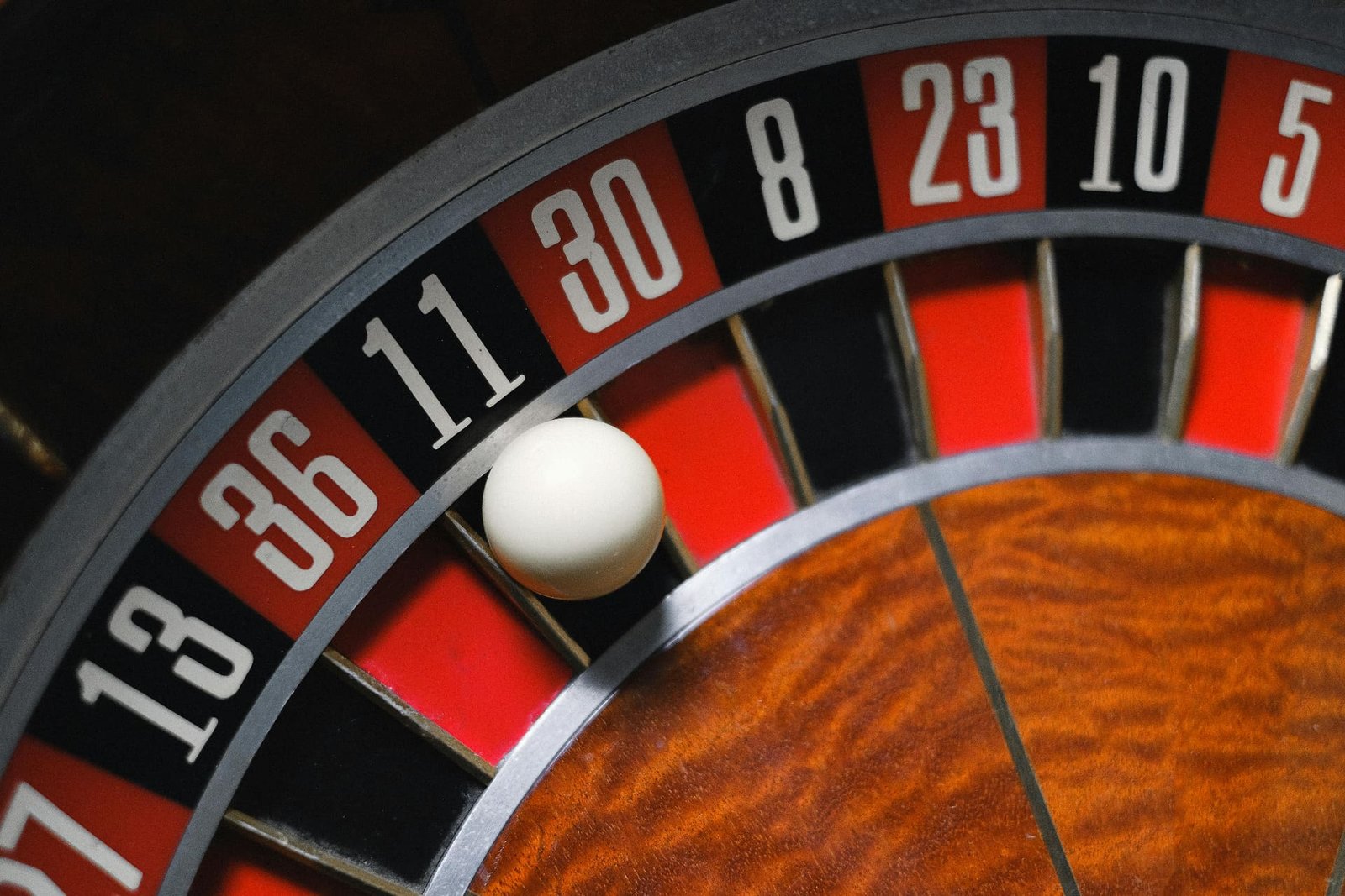 Roulette wheel with ball near number 11