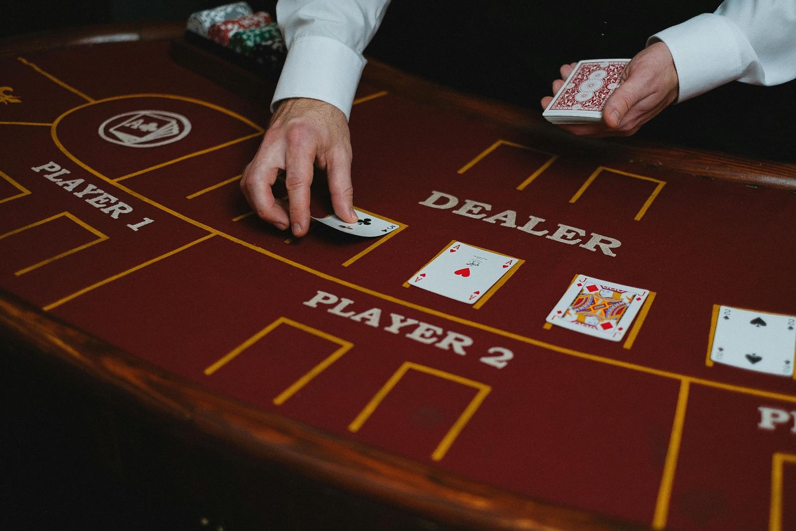 Dealer dealing cards at blackjack table